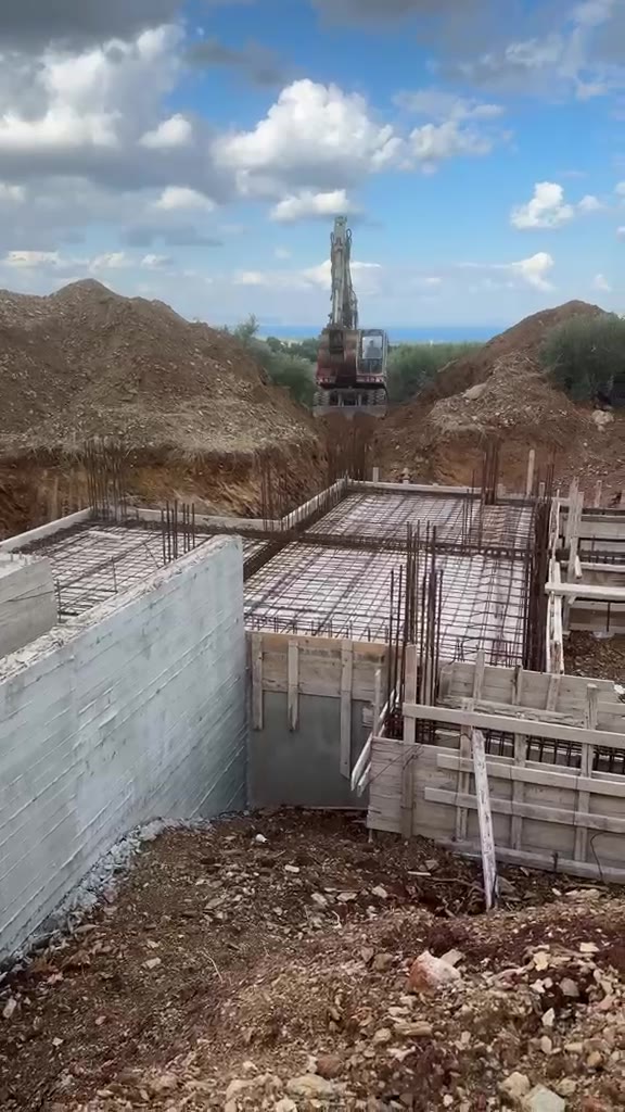 View across concrete walls and formwork on the current building site
